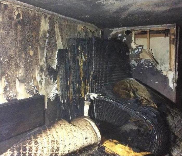 Bedroom covered in soot after a fire