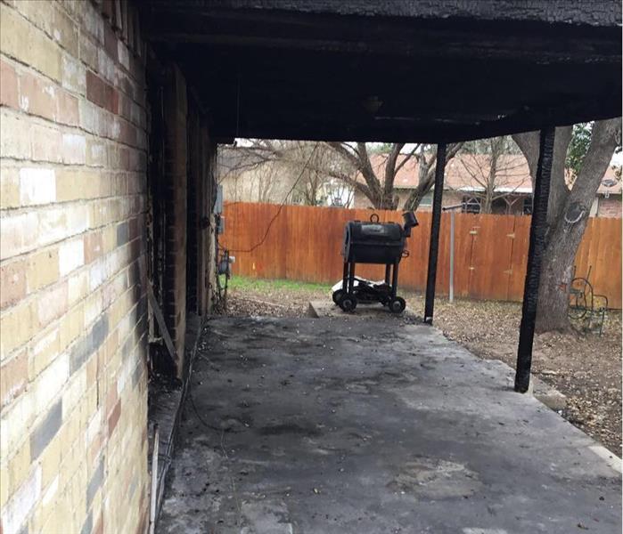 Back patio covered in soot after a fire