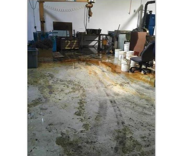 warehouse floor covered in oil